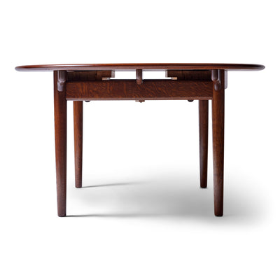 Rare Extension Table in Solid Teak and Oak by Hans J. Wegner for Johannes Hansen