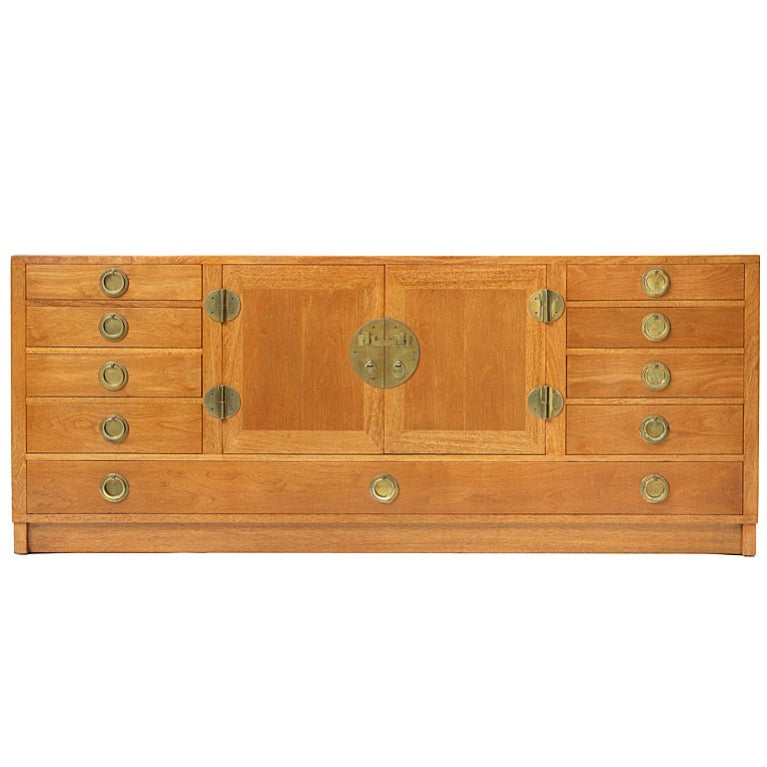 a Modernist sideboard cabinet with unique bronze hardware. by Edward Wormley for Dunbar - WYETH